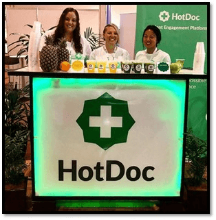 HotDoc mobile juice bar serving fresh green and yellow juices at a corporate event